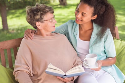 Senior-woman-and-young-carer-b