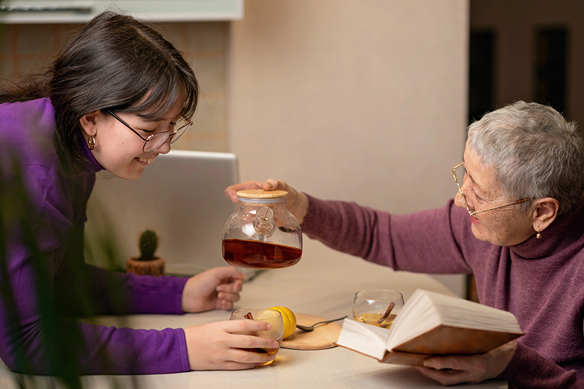 grandmother-granddaughter-drink-tea