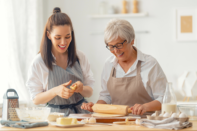 Happy family in the kitchen. Mother and her adult daughter