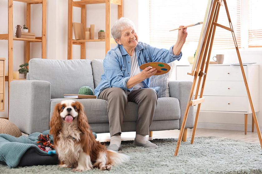 Senior woman with cute cavalier King Charles